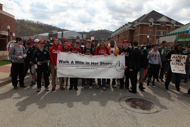 Men slip into high heels to walk for an end to violence against women.