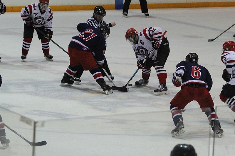 Vulcans and Colonials players battle off a faceoff during the Vulcans win. Cal 1 has won every year for the Cal U Hockey Homecoming Series