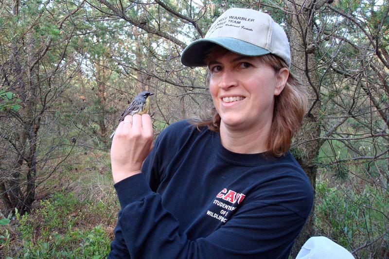 Carol Bocetti is pictured with the Kirtland’s warbler.