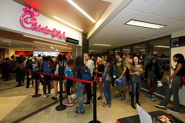 Students+line+up+to+get+a+taste+of+Chick-fil-A+at+the+grand+opening.