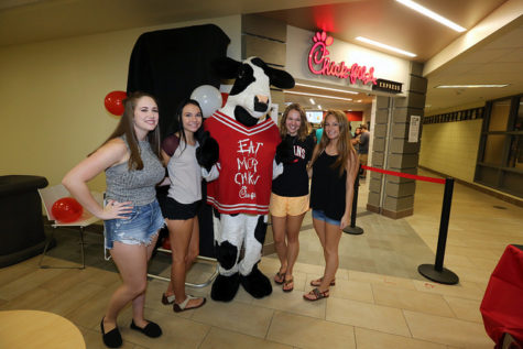 Freshman Isabella Frucella, Sabra Mayancsik, Maddie Beard and Eva Grove spend some time with the Chick-fil-A cow.