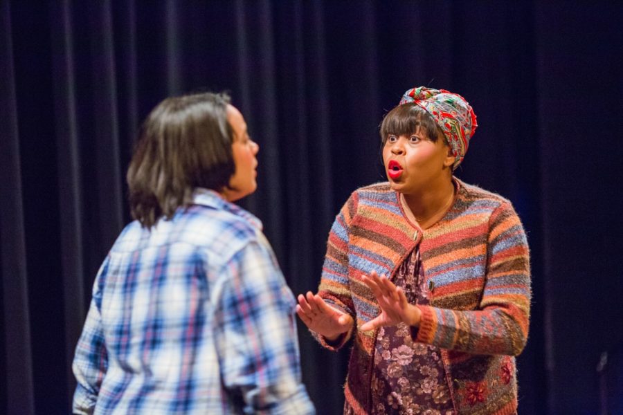 Sophomore Sabria Johnson (Landlady) rehearses with senior Emily Marmol (Laura).