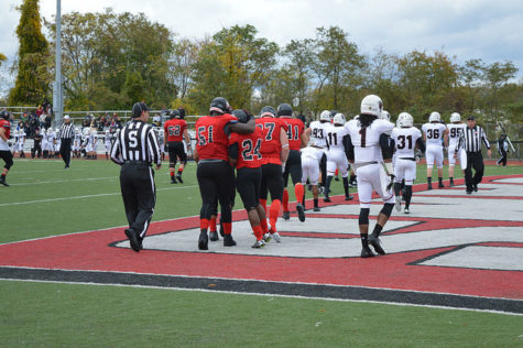 Craig McCorkle (51) and Nick Grissom (24) celebrate after a Vulcan touchdown.