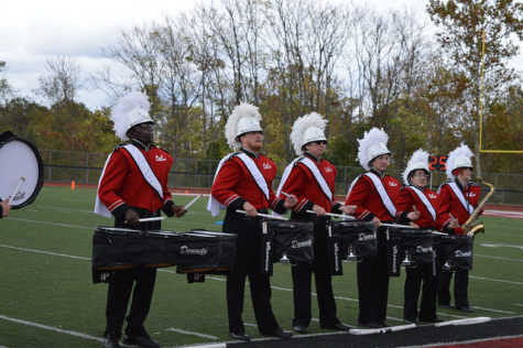 Members of the drum-line perform during halftime. 