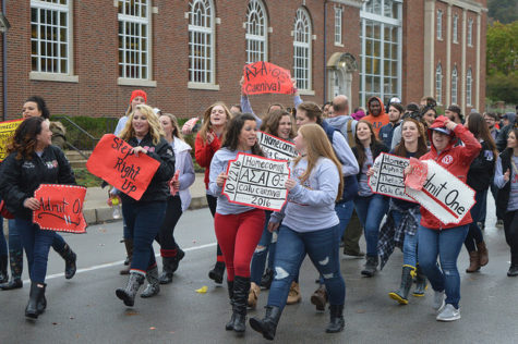 The sisters of Alpha Sigma Alpha and brothers of Theta Xi show some pride during the parade.