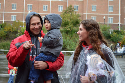 Professor JP Staszel and his family enjoy the homecoming pre-parade festivities.