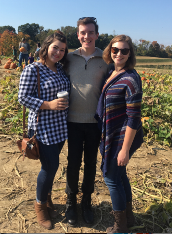 Enjoying their time at the pumpkin patch, juniors Sidney Popielarcheck, Mark Barret and Kayla Grimm take a photo.