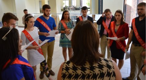 Students who made homecoming court listen to Missy Dunn as she explains the homecoming schedule.