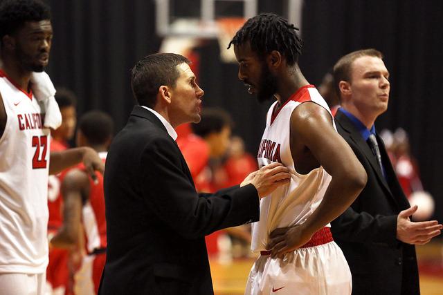 Kent McBride talks to Robel Teckle (#0).