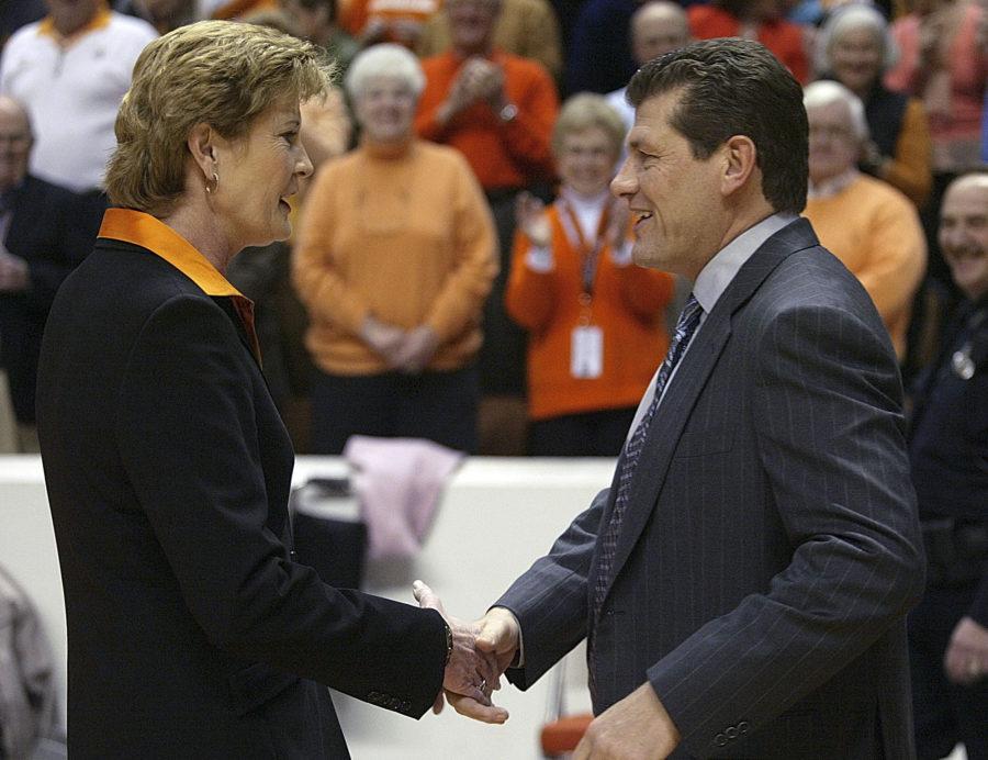 UCONN womens basketball coach, Geno Auriemma, and Tennessee womens basketball coach, Pat Summitt, shake hands.