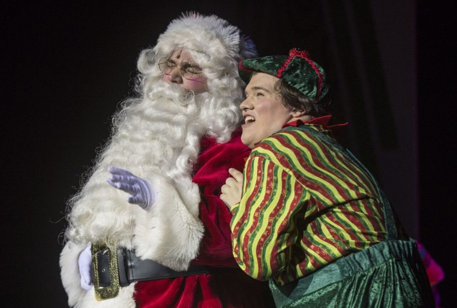 Senior, Nick Franczak, and sophomore, Jeshua Myers, share a moment on stage as Santa and Eubie.