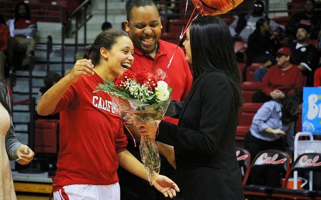 Miki Glenn hugs head coach Jess Strom.