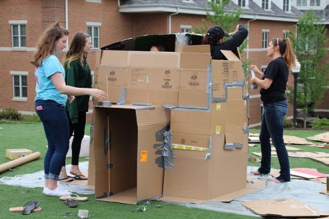 Members of Sigma Kappa begin building their igloo for the