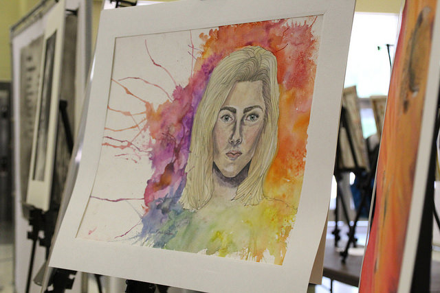 A students art is displayed in the Convocation Center for the Strike a Spark conference.