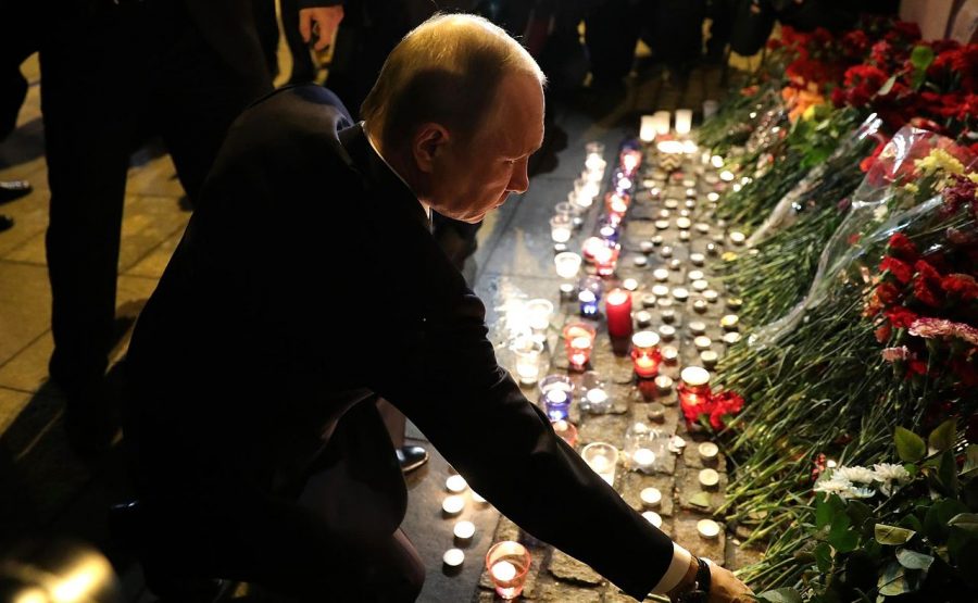 Russian Primer Minister, Vladimir Putin, lays down flowers at makeshift memorial for the St. Petersburg metro bombing victims.