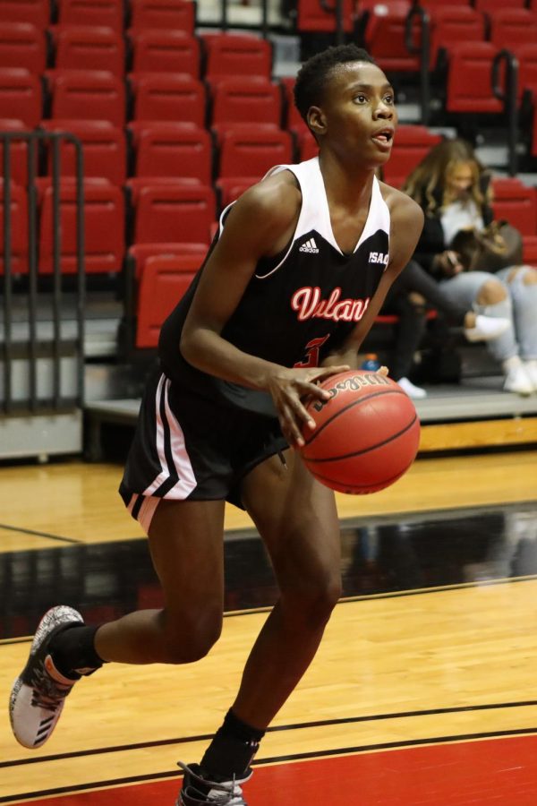 Shatara Parsons attempts a shot at home against Mansfield University