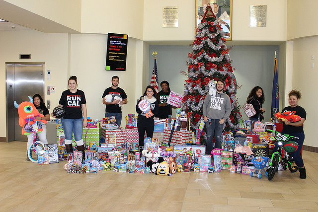 Members of student government pose with the toys donated for Toys for Tots.