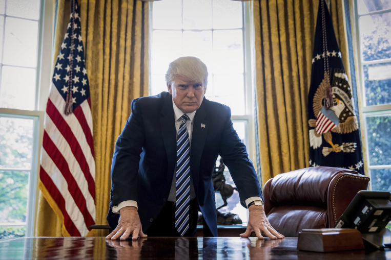 Photo of President Donald j. Trump in the Oval Office courtesy of Andrew Harnik/Associated Press.