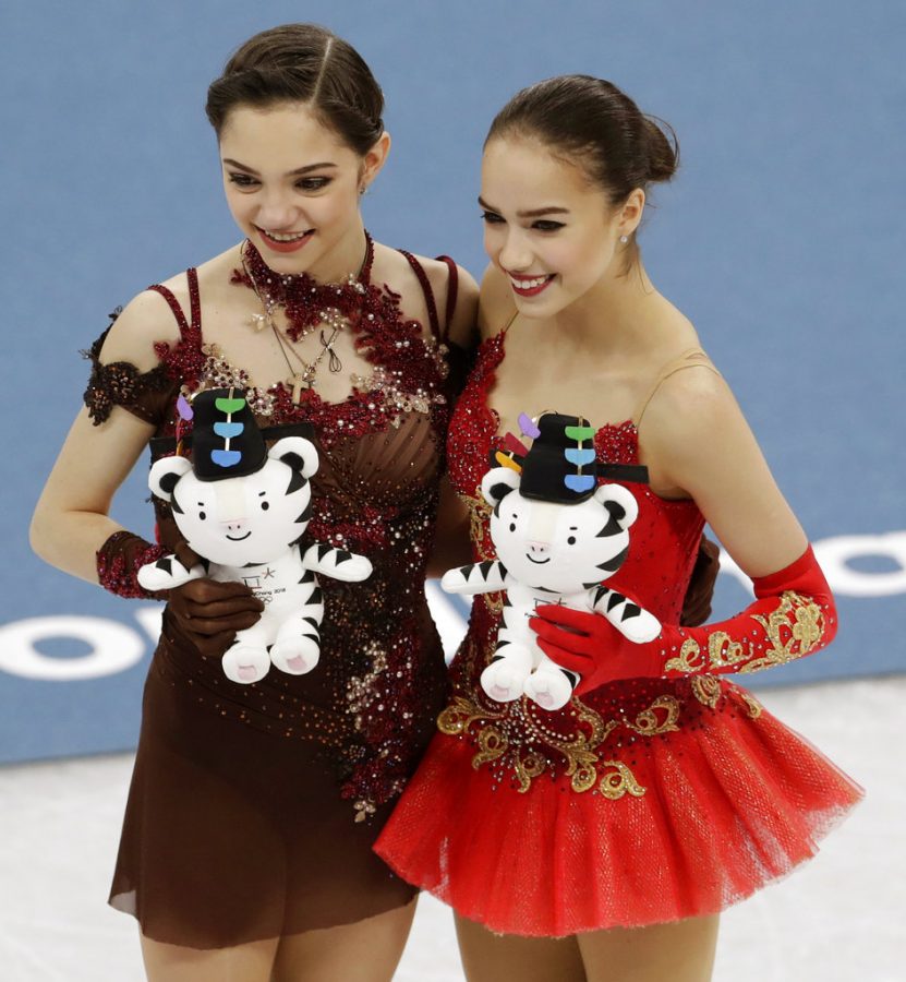 Photo of gold medalist Alina Zagitova, right, and silver medalist Yevgenia Medvedeva of Russia courtesy of Petr David Josek/Associated Press.