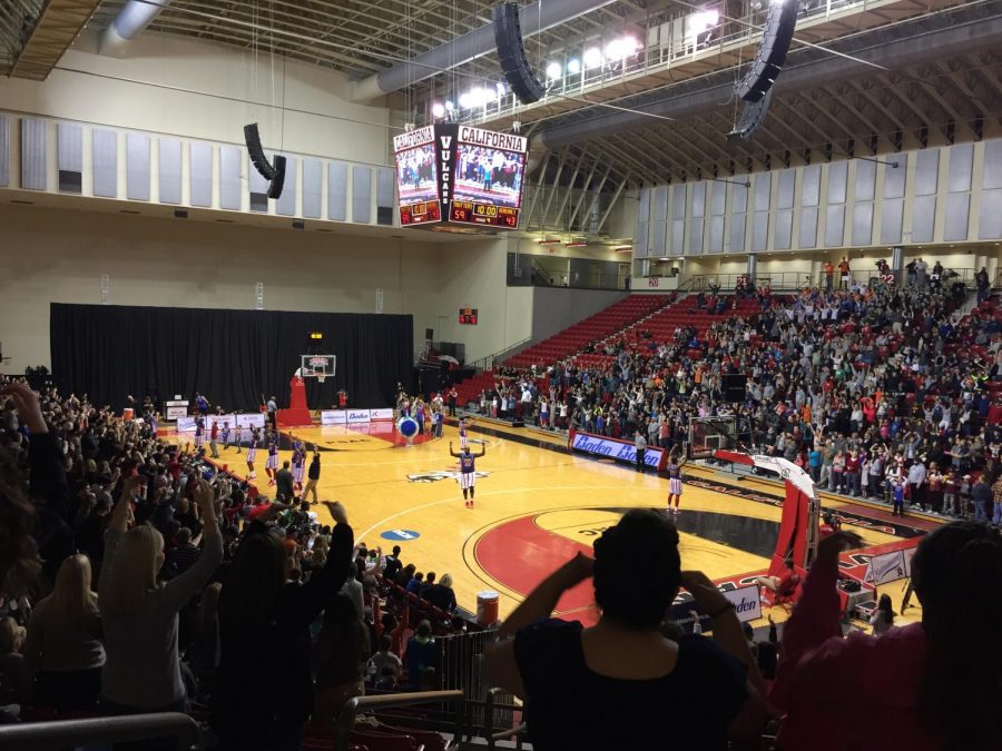 The Harlem Globetrotters lead the audience in the YMCA.