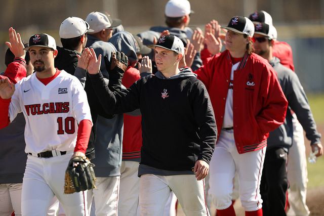 Carter Krick high fives his teammates at the Washington Wild Things Park ater Cal U defeated West Liberty, 7-6, in Game 1 on March 5.