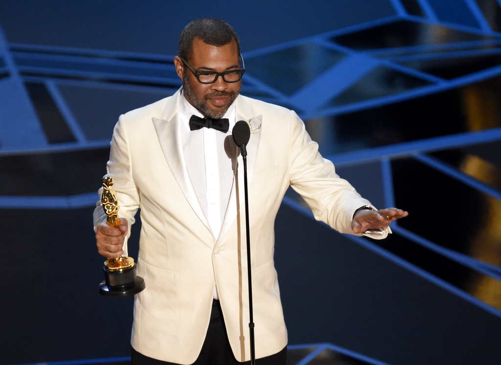 Photo of Jordan Peele accepting his Oscar for Best Screenplay for