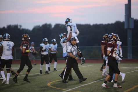 Prexies celebrate a score.