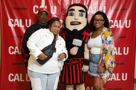 (Sept. 22) Families and friends pose for portraits with Blaze, the Vulcan mascot, at Cal U's Family Day 2018