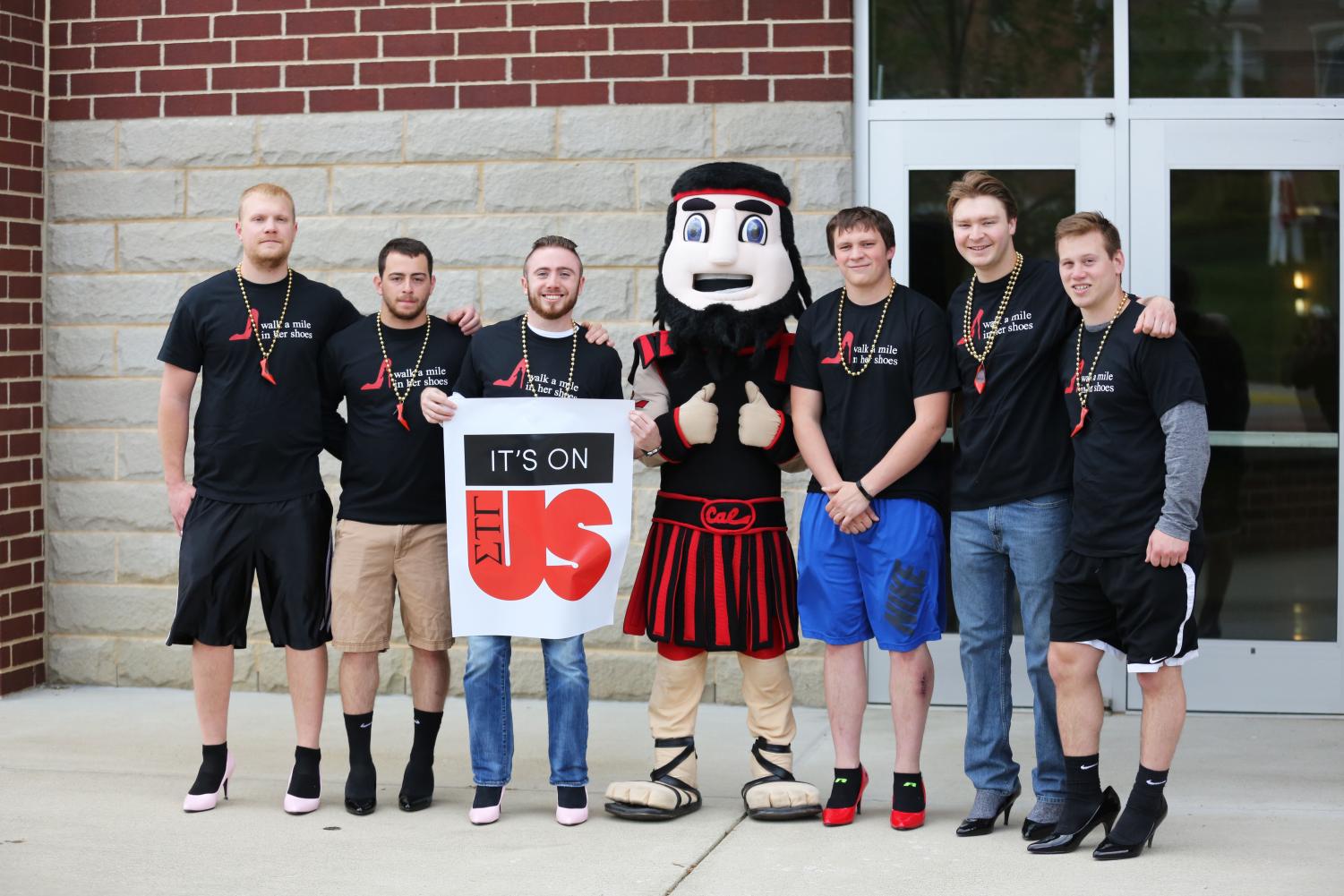 The men of California University of Pennsylvania wear high-heeled pumps and make their way around campus as they participate in the annual