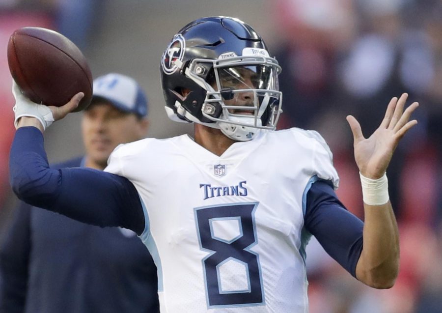 Titans quarterback Marcus Mariota (8) passes the ball during the warm-up before an NFL football game against Los Angeles Chargers at Wembley stadium in London.