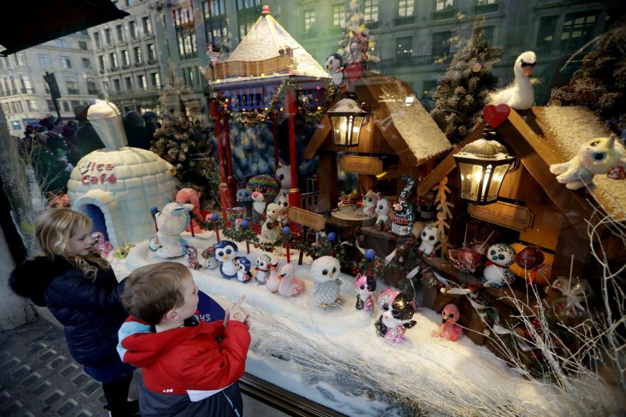 Children look at the newly unveiled Hamleys toy store Christmas window display which features Ty cuddly plush toys, on Regent Street in  London, Friday, Nov. 2, 2018.