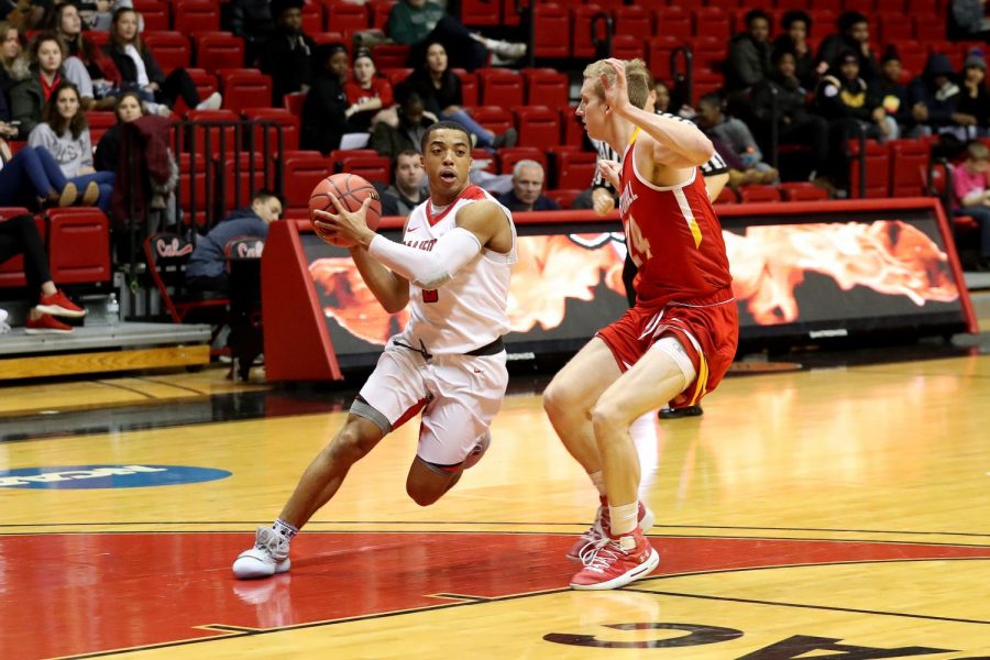 Brent Pegram driving to the hoop against Seton Hill University