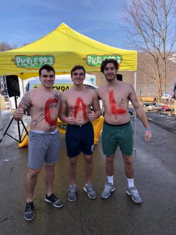Members of the California University of Pennsylvania football team ready to jump into the icy waters at the Frosty Frolic River Romp in Coal Center, Pa. February 2, 2019