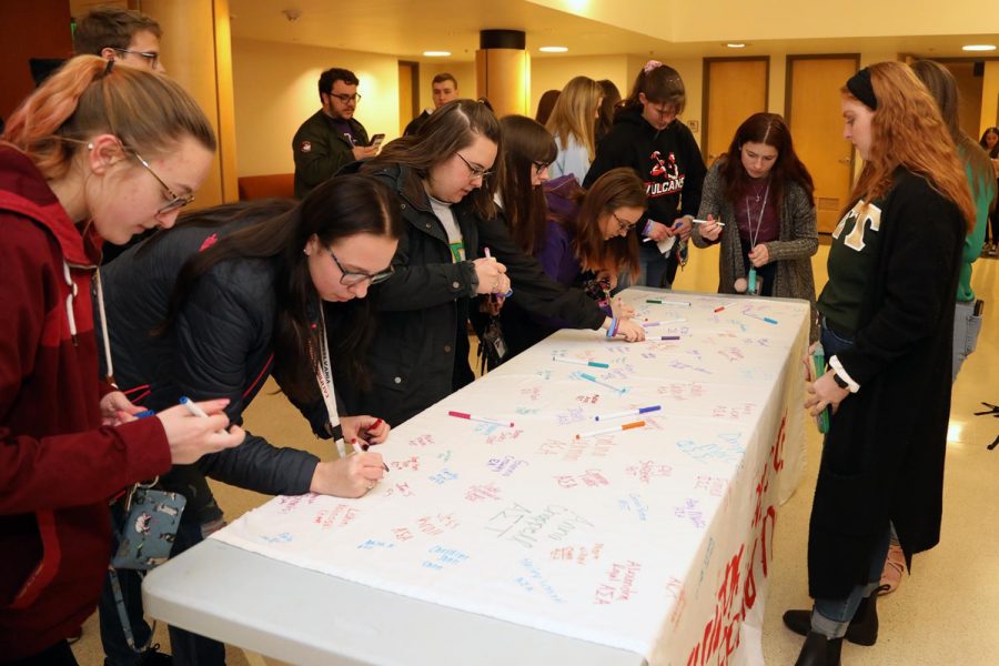 Members of Cal U fraternities, sororities, sports clubs and others gathered in the Steele Auditorium lobby on Feb. 23, 2020, to sign a banner pledging not to participate in hazing activities.  The banner will be on display in the Natali Student Center.