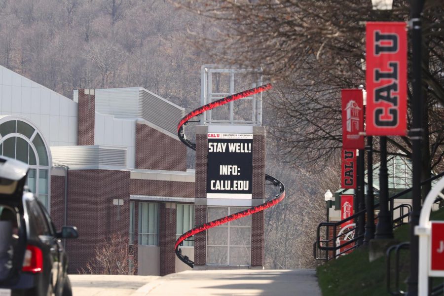 A sign on the Cal U Convocation Center advises all to  Stay Well as the University prepares to shut down the campus and transition to remote operations in response to the coronavirus pandemic  on Sunday, March 22, 2020.