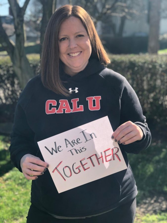 Becky McMillen, executive director of  Conference Services at Cal U, displays a  sign of strength for the Student Affairs #CalUTogether video, April 1, 2020