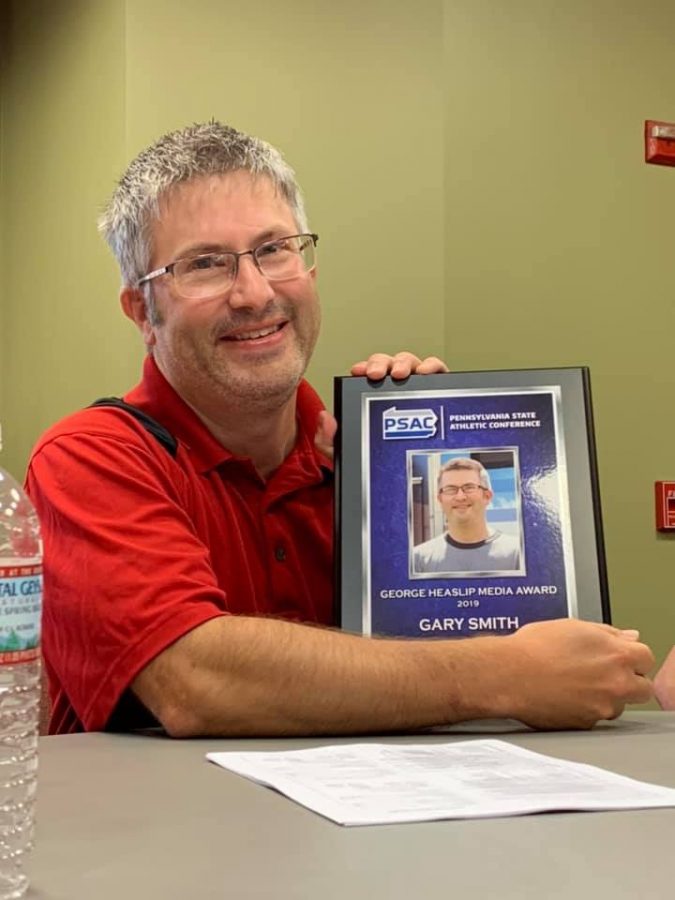 Head director and advisor of CUTV Gary Smith with his 2019 George Heaslip Media Award. 
