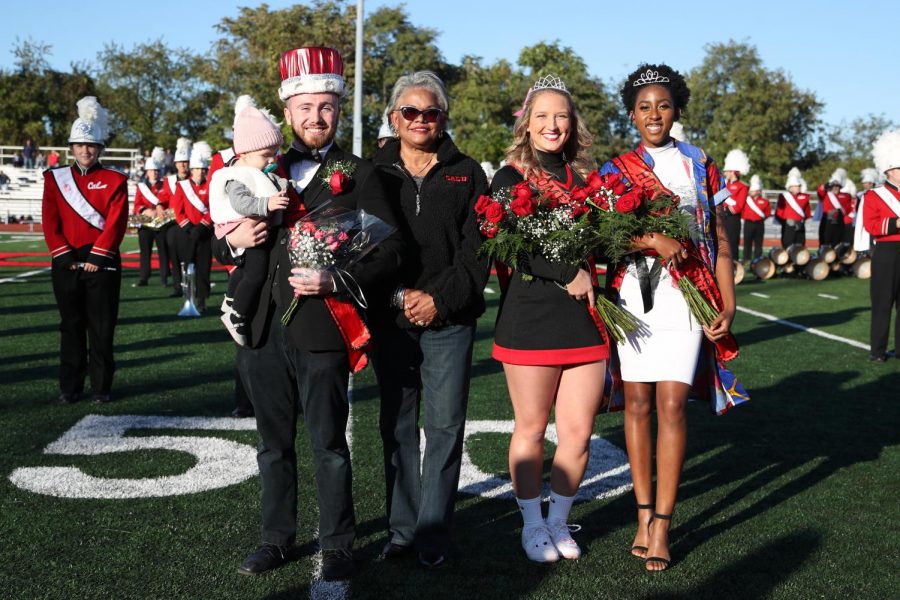 (FILE Oct. 12, 2019) Cal U President Geraldine M. Jones crowned Homecoming royalty during halftime at the football game on Oct. 12, 2019.  From left, Eric Townsend was crowned Homecoming King; Co-Queens were Maddie Rush and Cynthia Obiekezie.