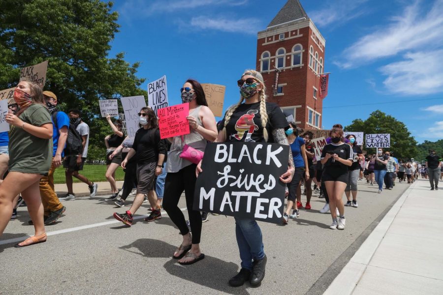 Hundreds march past the Booker Towers at California University of Pennsylvania in a peaceful protest against police brutality on June 7, 2020.