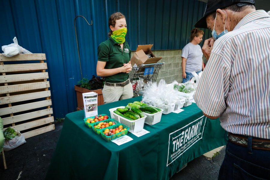 Morgan Livingston, agricultural innovation manager,  The Farm vending booth featuring fresh produce grown at the Greater Washington County Food Bank.