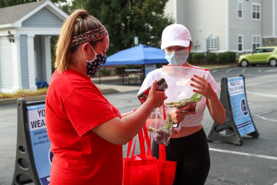 First-year students Sarah Tinker, Masontown, Pa. and Taylor Tubbs, Smithfield, Pa. at a  California University of Pennsylvania Welcome Weekend event at the off-campus Vulcan Village apartments on Aug. 22. 