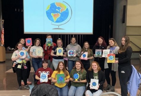 GSS members pose with works of art made at their 'Paint & Sip' event during late February.