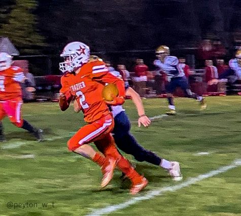 Frazier senior Kenny Fine (#2, red) carries the ball past Beth-Center's defenders as the Commodores defeated the Bulldogs on senior night in Perryopolis on Friday, Oct. 17.
