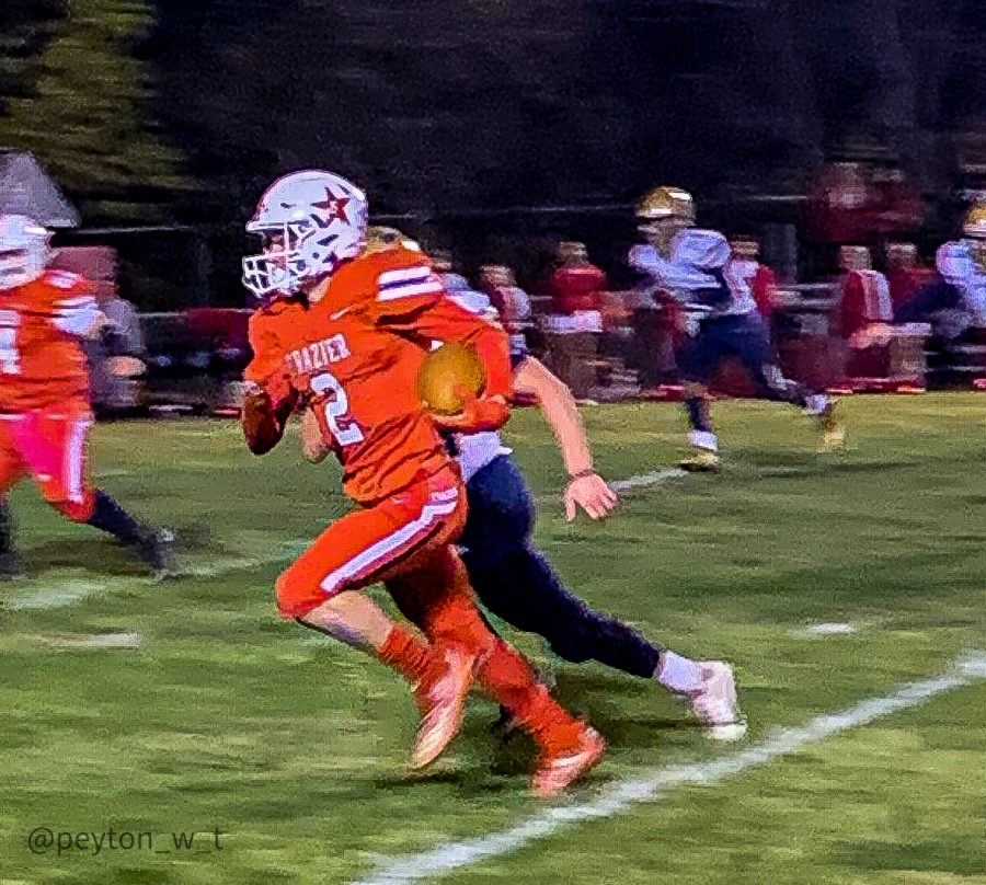 Frazier senior Kenny Fine (#2, red) carries the ball past Beth-Centers defenders as the Commodores defeated the Bulldogs on senior night in Perryopolis on Friday, Oct. 17.