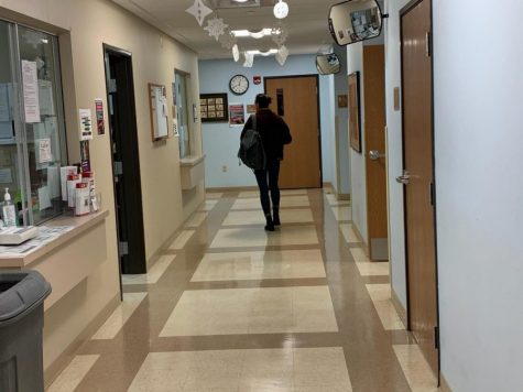 A student walking down the hallway of the Health Center located in Carter Hall. (Jan. 2020) 