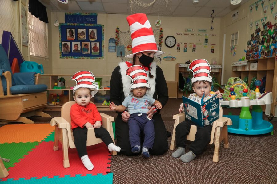 Ashley Roth, director, wears The Cat-in-the-Hat costume to read the popular childrens book to toddlers at The Village in California, Pa. March 2, 2021