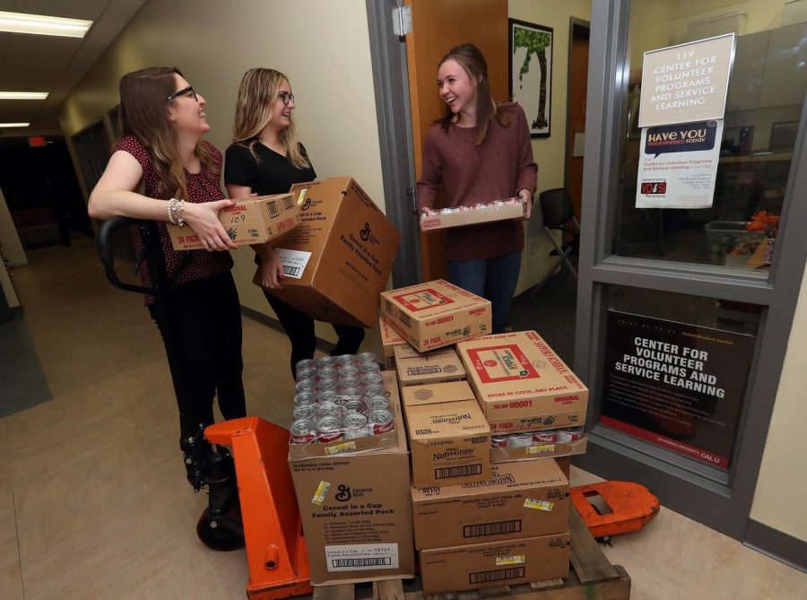 Workers of the Cal U Cupboard accepting and sorting donations in the Natali Student Center.