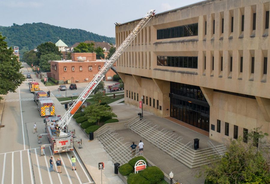An aerial truck from the California Volunteer Fire Department is positioned in front of Manderino Library at California University of Pennsylvania as part of an emergency preparedness training exercise.