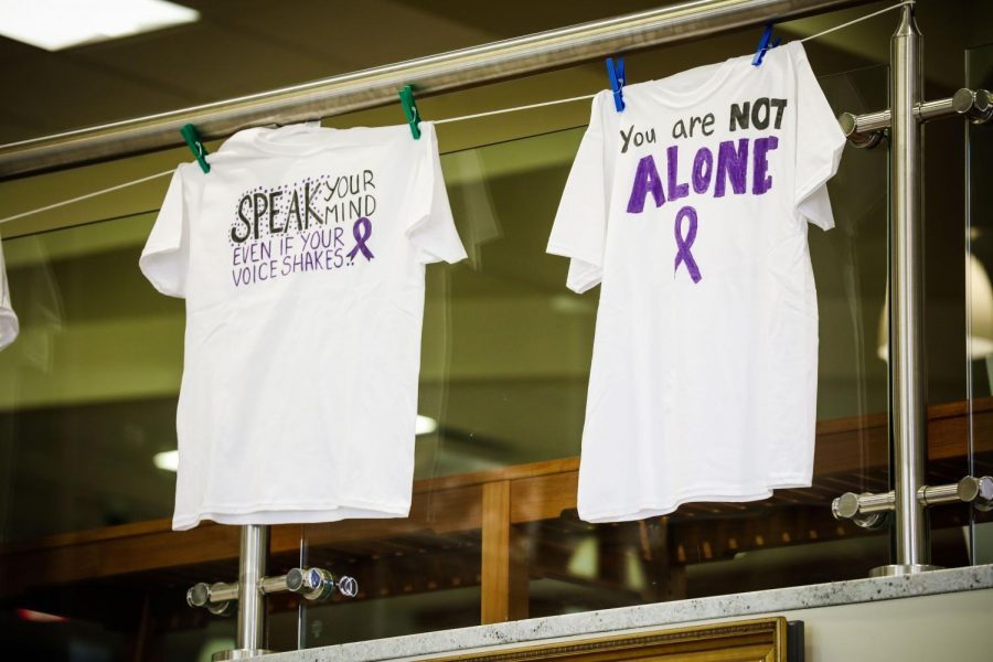 Shirts of the End Violence Centers Clothesline Project hanging in the Natali Student Center, Oct. 18, 2021.  The project is a visual display that addresses the issue of domestic violence and brings awareness to its impact. 