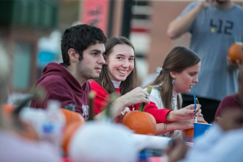 Cal U student Rebekah Schrack looks at the camera while participating in the pumpkin painting event at the Cal U Fall Fest, Oct. 20, 2021